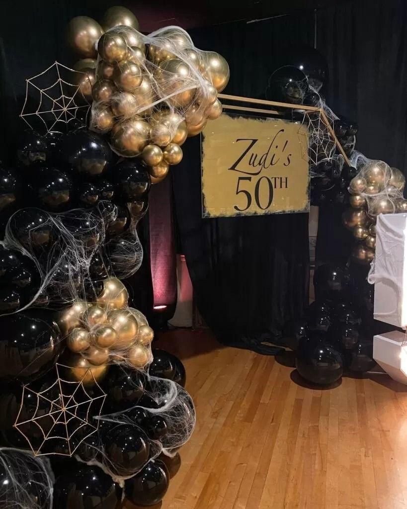 Golden entrance backdrop for milestone birthday
