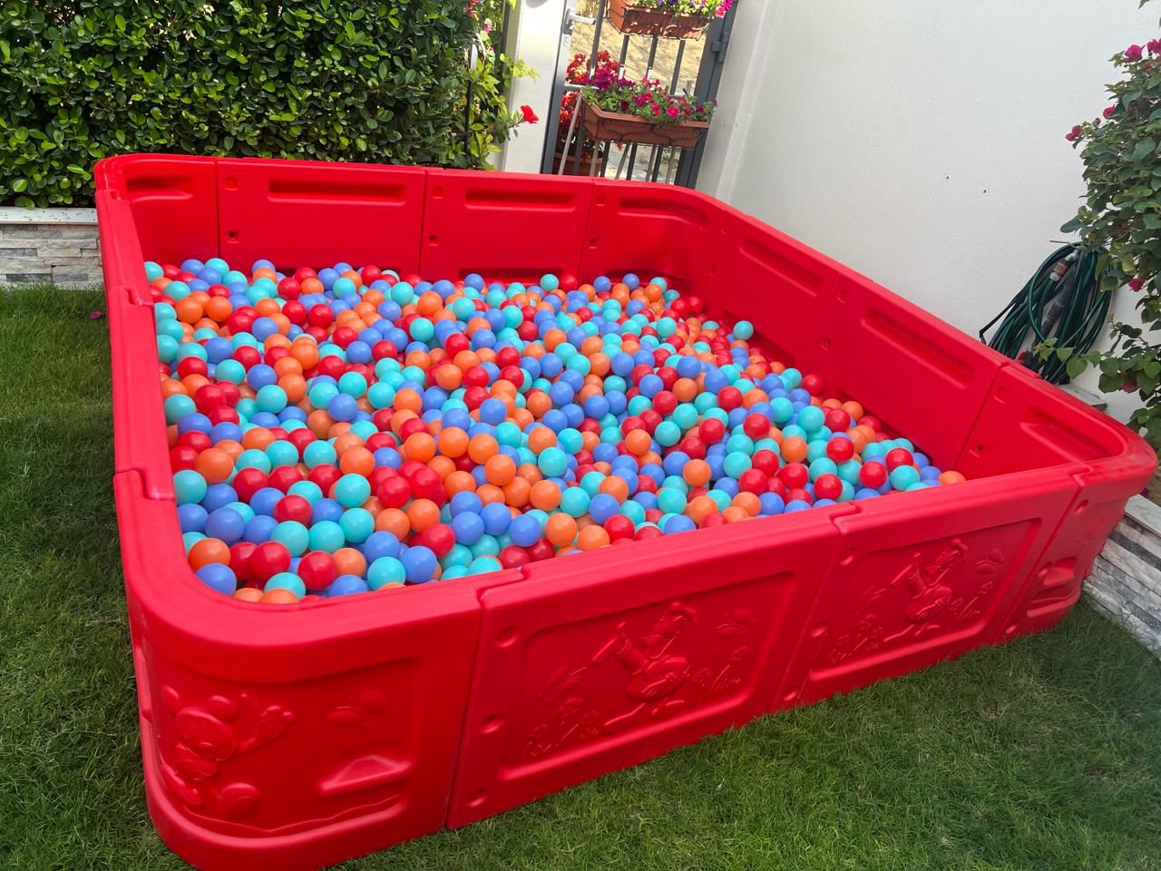 Portable red ball pit for kids rental setup