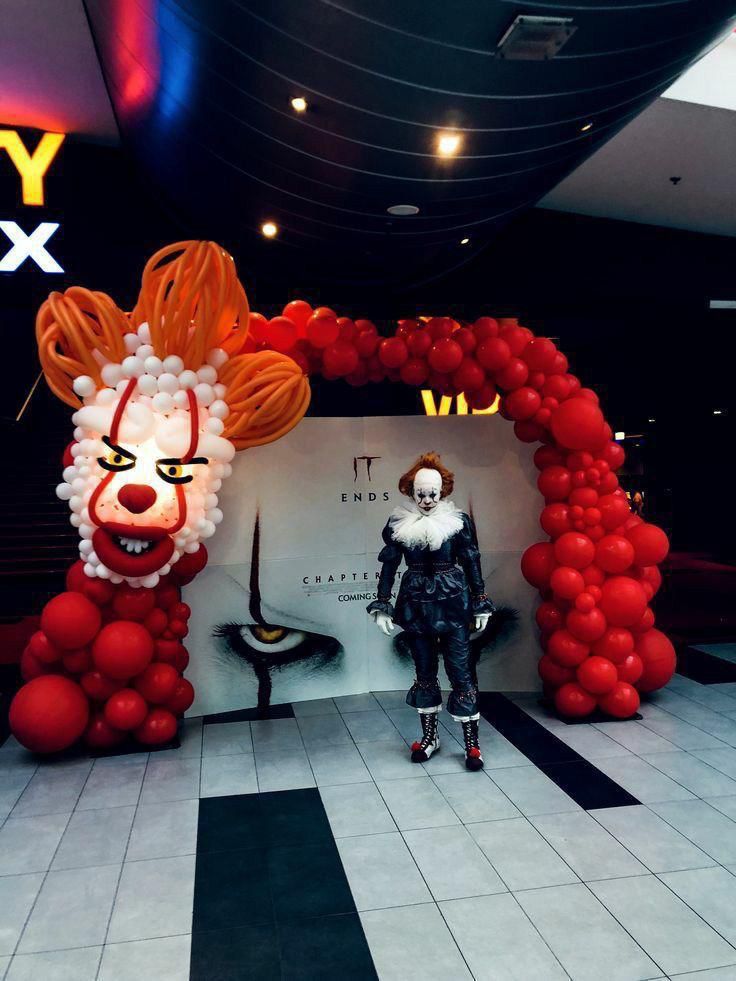 Red clown balloon entry tunnel for party setup
