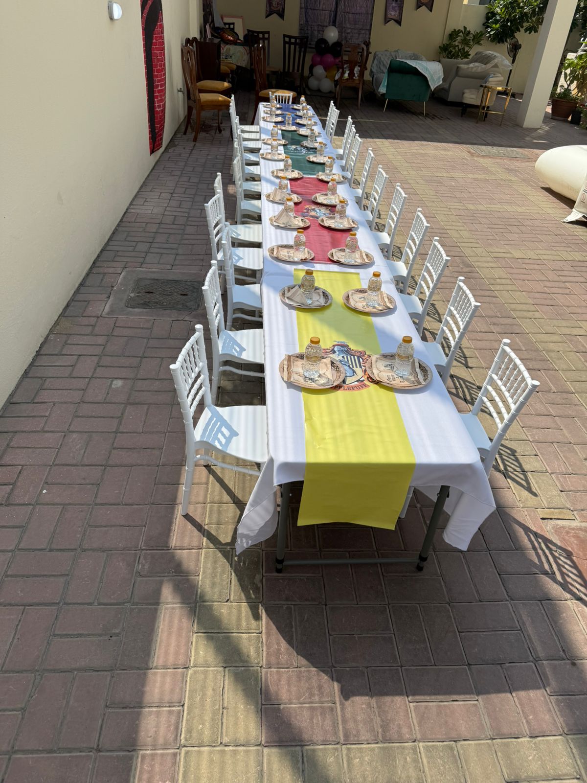 Long kids dining table set outdoors for rental event